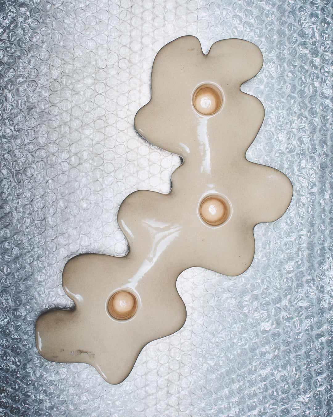 Triple sandstone candlestick