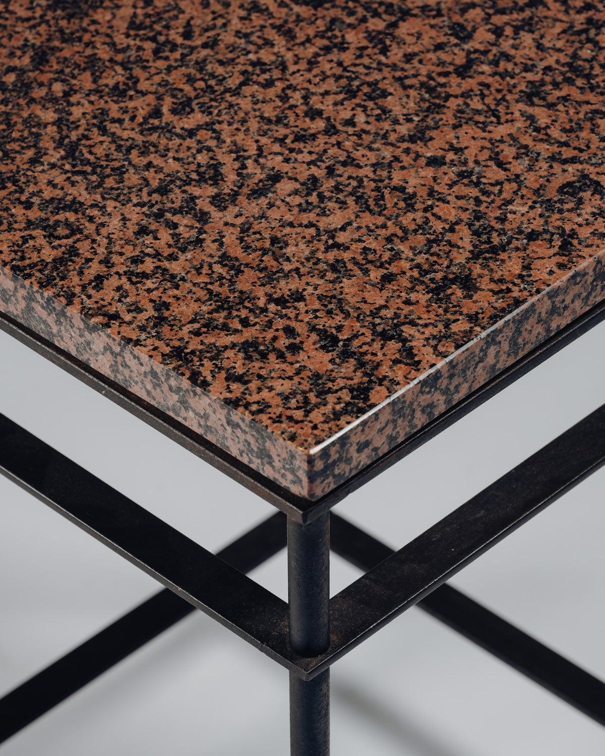 SIDE TABLE IN IRON AND PINK GRANITE, JEAN-MICHEL WILMOTTE, 1980s