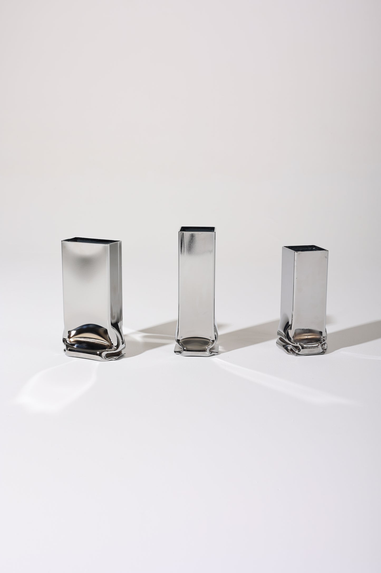 SMALL RECTANGULAR "PRESSURE" CHROME VASE