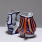 TWO YING-YANG PORCELAIN PITCHER, O. CASTRO, 2000s