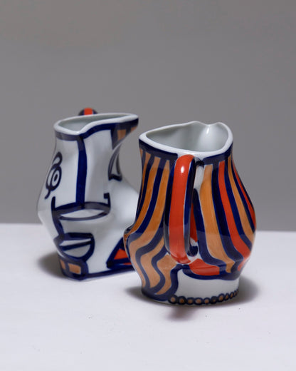 TWO YING-YANG PORCELAIN PITCHER, O. CASTRO, 2000s