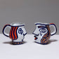 TWO YING-YANG PORCELAIN PITCHER, O. CASTRO, 2000s