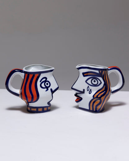 TWO YING-YANG PORCELAIN PITCHER, O. CASTRO, 2000s