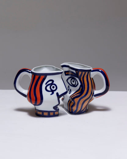 TWO YING-YANG PORCELAIN PITCHER, O. CASTRO, 2000s