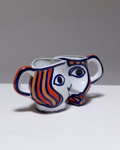 TWO YING-YANG PORCELAIN PITCHER, O. CASTRO, 2000s