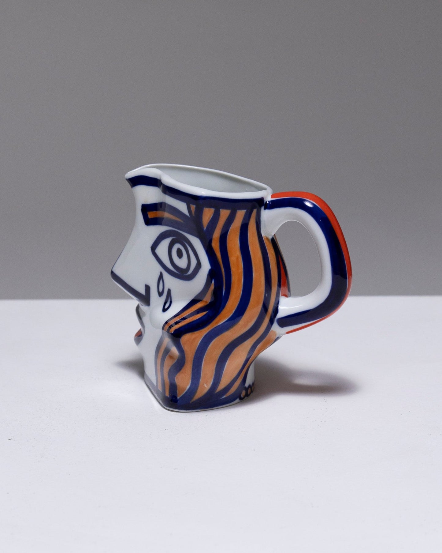 TWO YING-YANG PORCELAIN PITCHER, O. CASTRO, 2000s