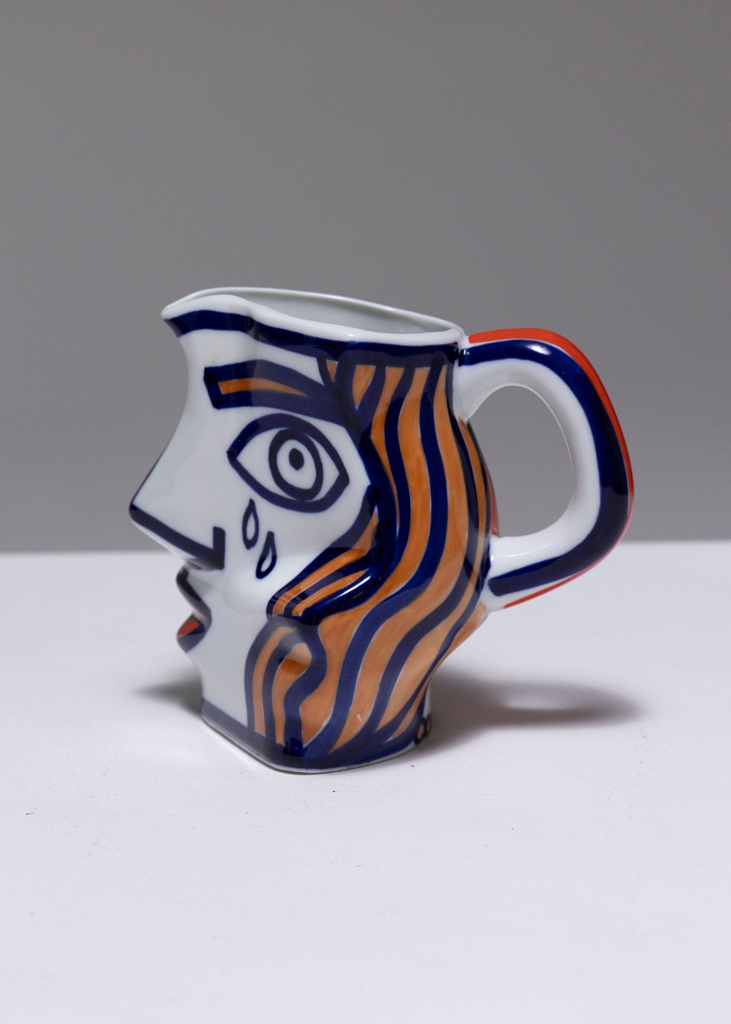 TWO YING-YANG PORCELAIN PITCHER, O. CASTRO, 2000s