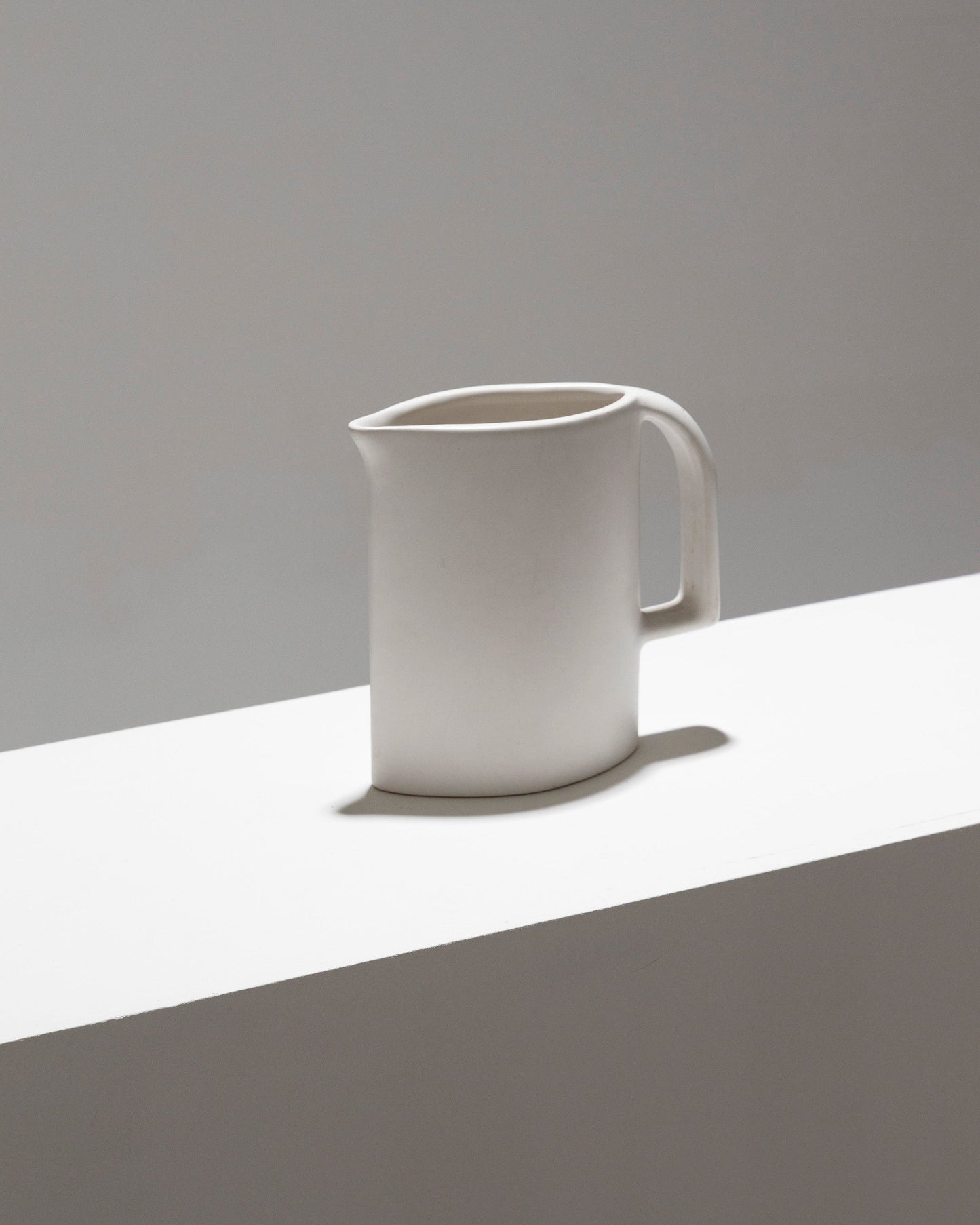 MATT WHITE EARTHENWARE PITCHER, 1970s