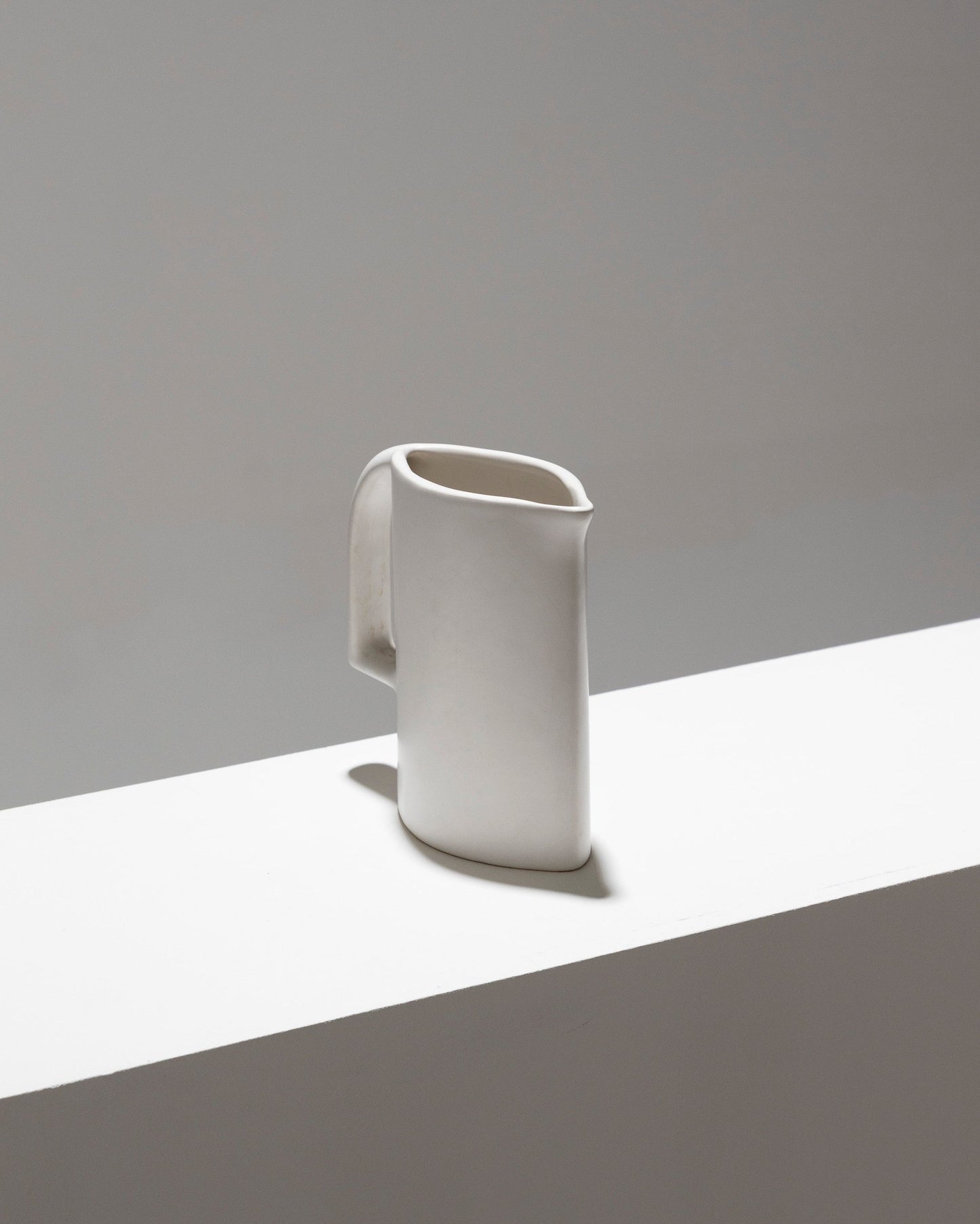 MATT WHITE EARTHENWARE PITCHER, 1970s