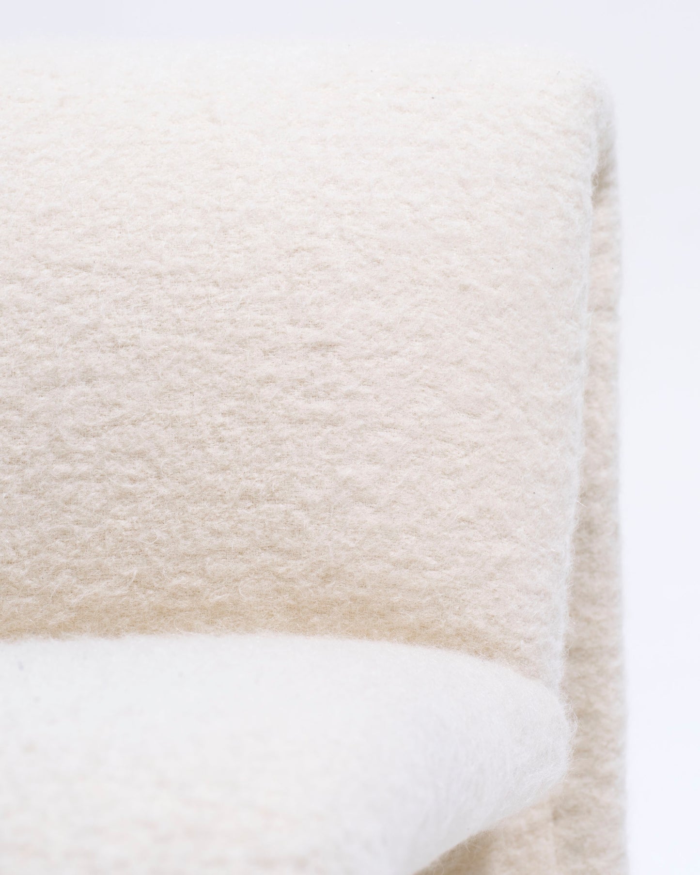 Pair of armless lounge chairs in white woolen fabric, Etienne Fermigier, 1970s