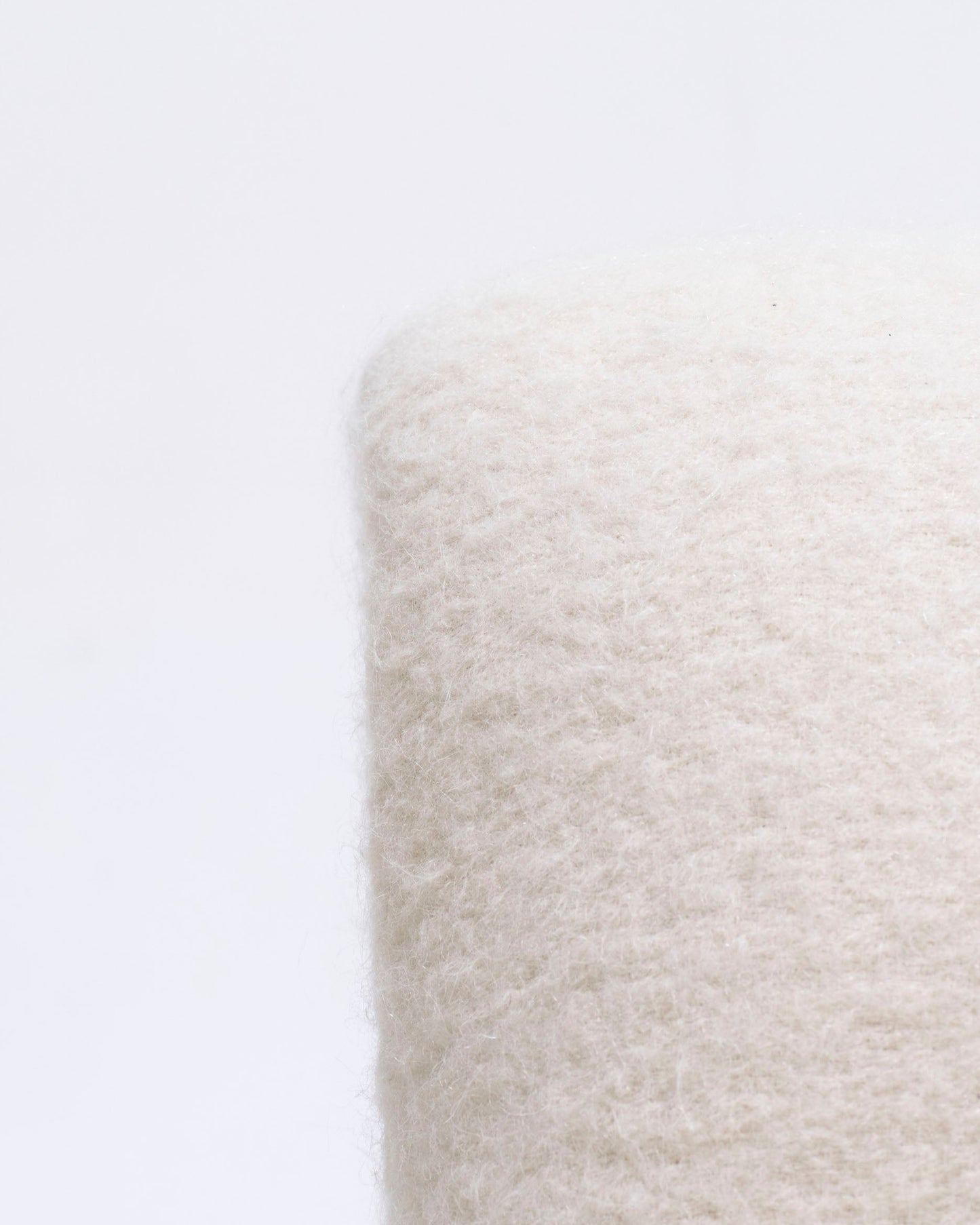 Pair of armless lounge chairs in white woolen fabric, Etienne Fermigier, 1970s