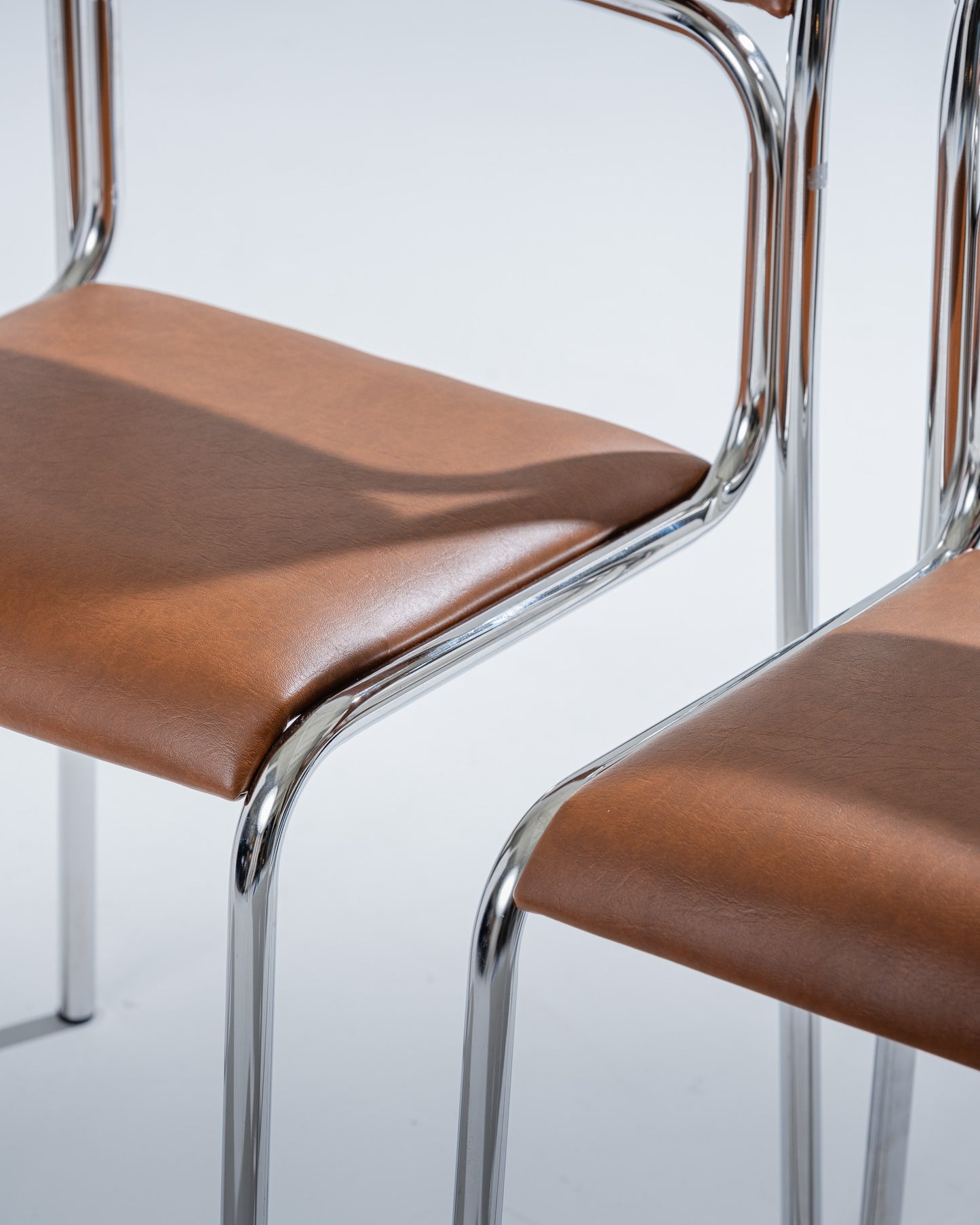 TUBULAR STEEL AND COGNAC LEATHERETTE CHAIR, 1980s
