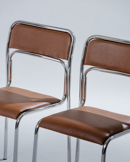 PAIR OF TUBULAR STEEL AND COGNAC LEATHERETTE CHAIRS, 1980s
