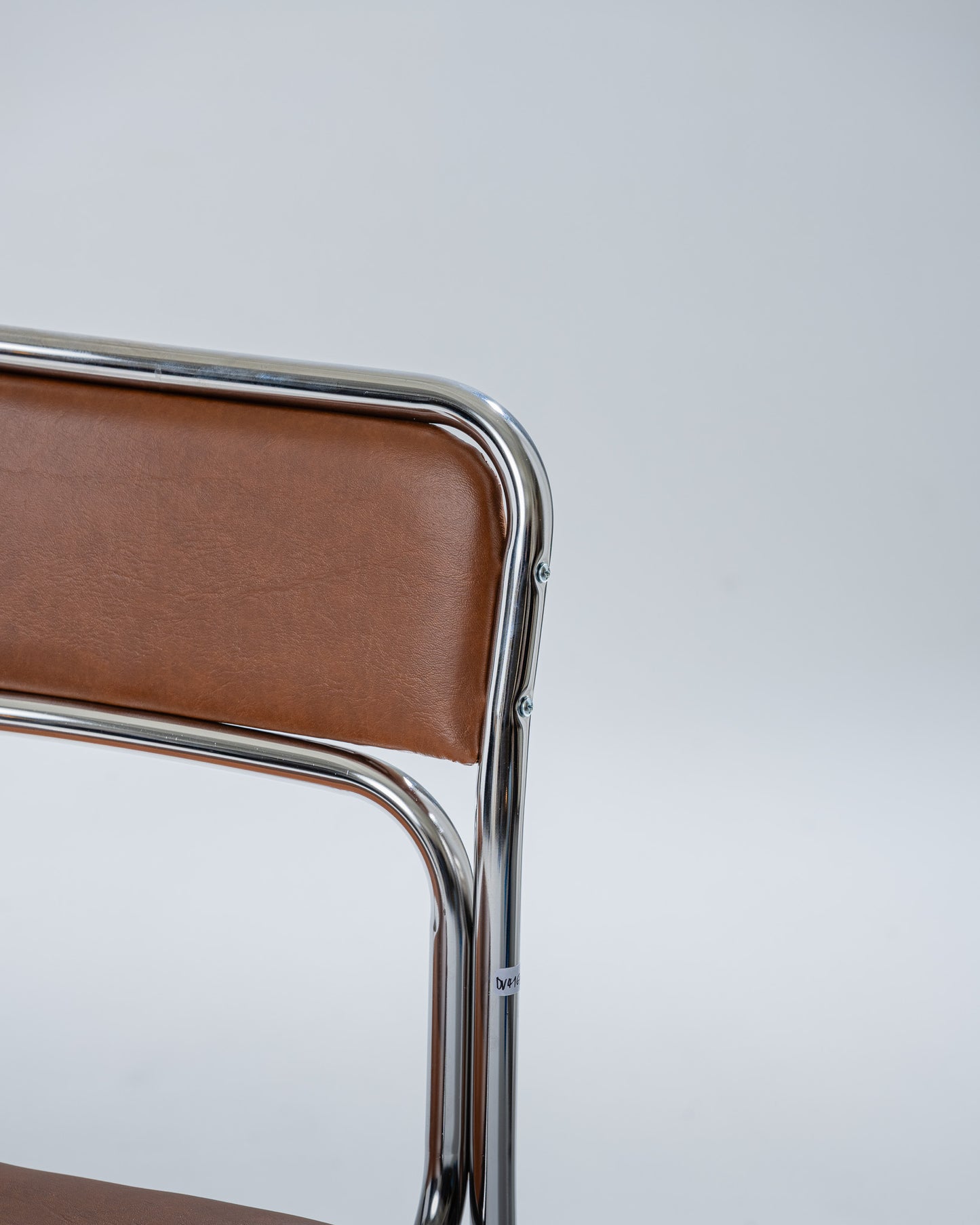 PAIR OF TUBULAR STEEL AND COGNAC LEATHERETTE CHAIRS, 1980s