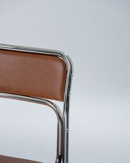 PAIR OF TUBULAR STEEL AND COGNAC LEATHERETTE CHAIRS, 1980s