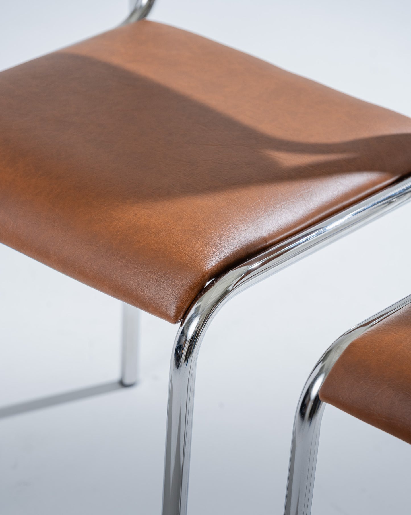 TUBULAR STEEL AND COGNAC LEATHERETTE CHAIR, 1980s