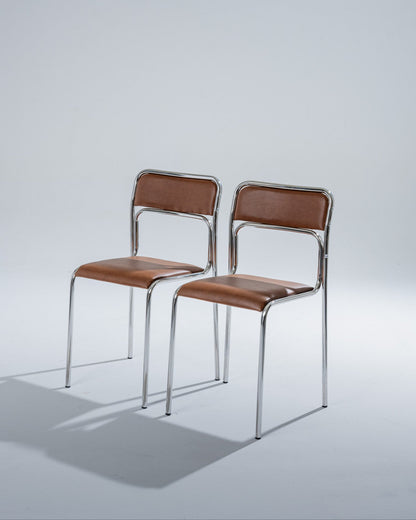 PAIR OF TUBULAR STEEL AND COGNAC LEATHERETTE CHAIRS, 1980s