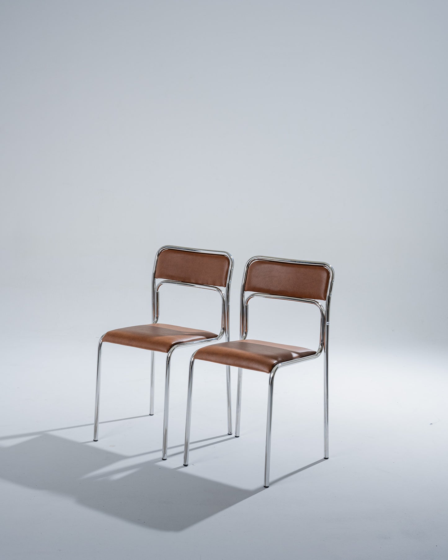 TUBULAR STEEL AND COGNAC LEATHERETTE CHAIR, 1980s