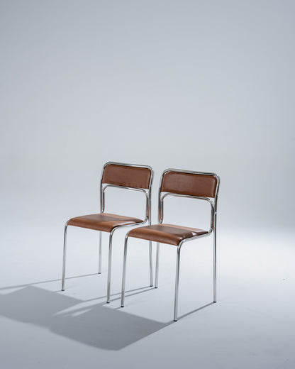 SET OF 4 CHAIRS IN TUBULAR STEEL AND COGNAC LEATHERETTE, 1980s