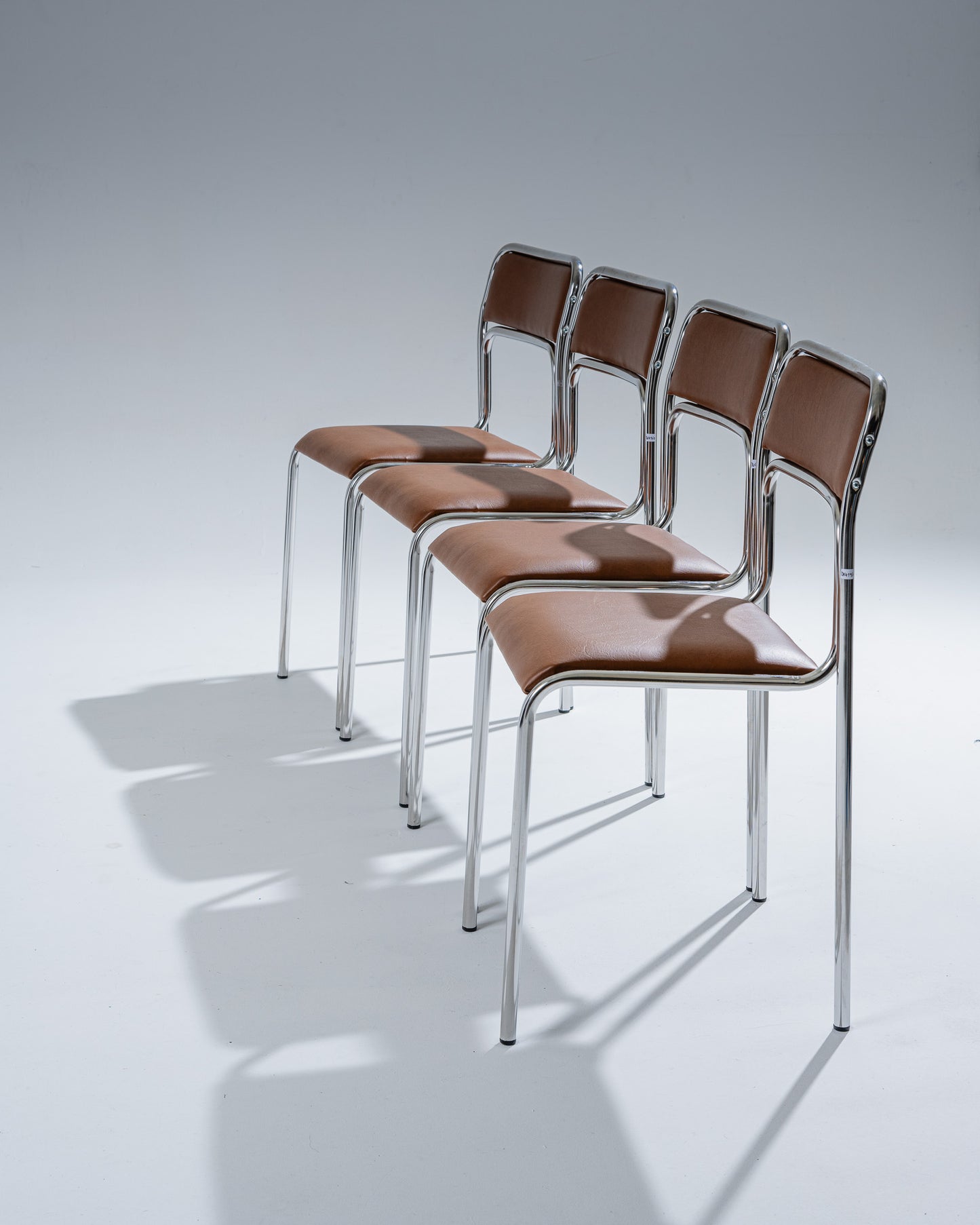 TUBULAR STEEL AND COGNAC LEATHERETTE CHAIR, 1980s