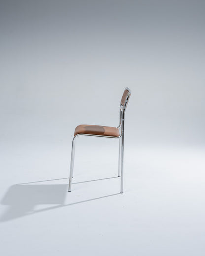 SET OF 4 CHAIRS IN TUBULAR STEEL AND COGNAC LEATHERETTE, 1980s