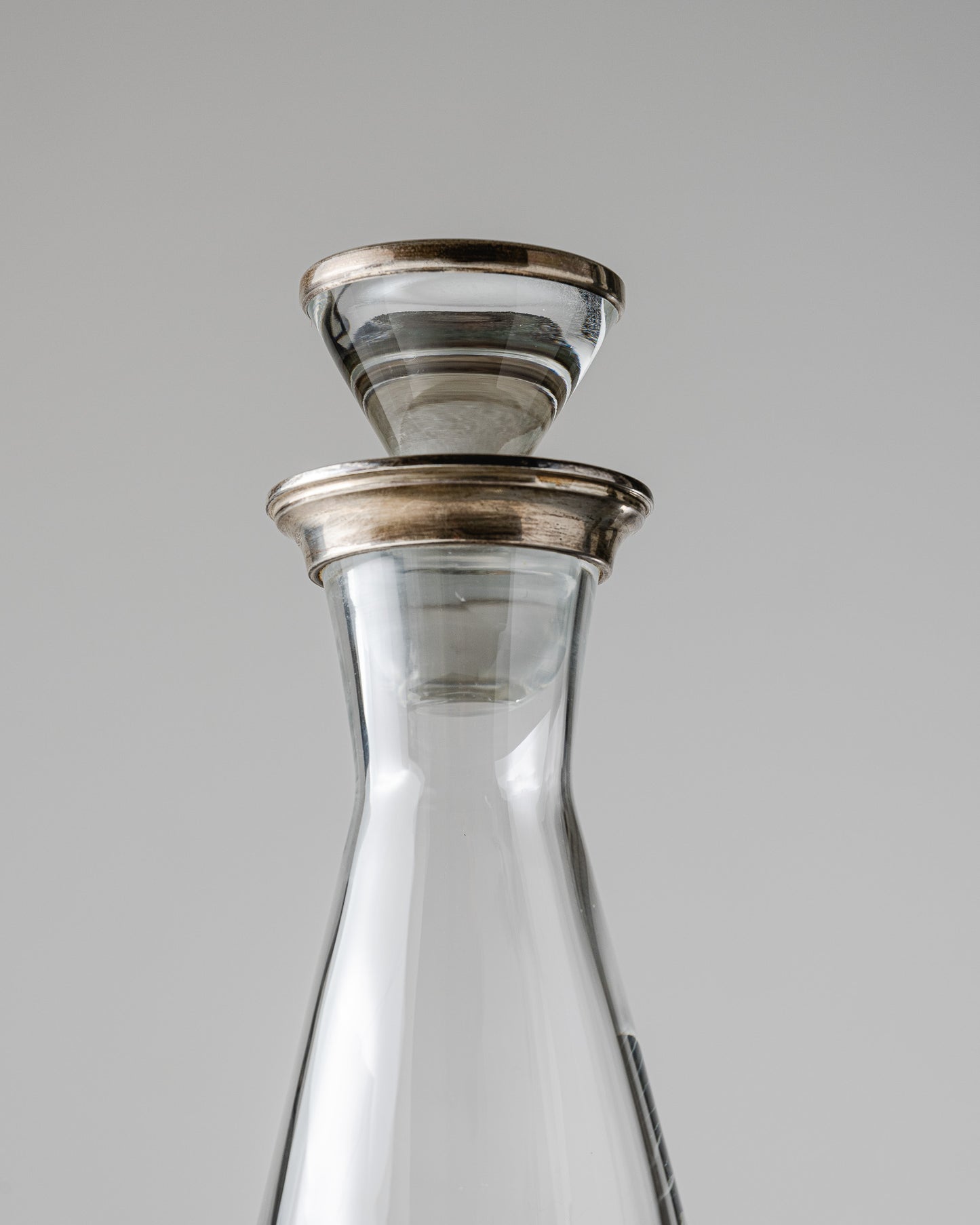 MODERN GLASS AND SILVER-PLATED METAL DECANTER, 2000s