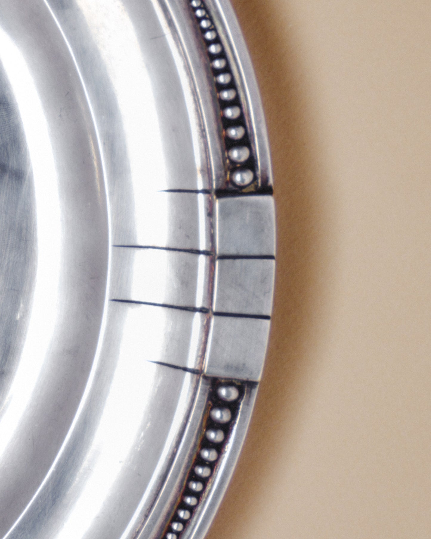 ROUND SILVER-PLATED METAL PLATE, SAMUEL ASKENFELD