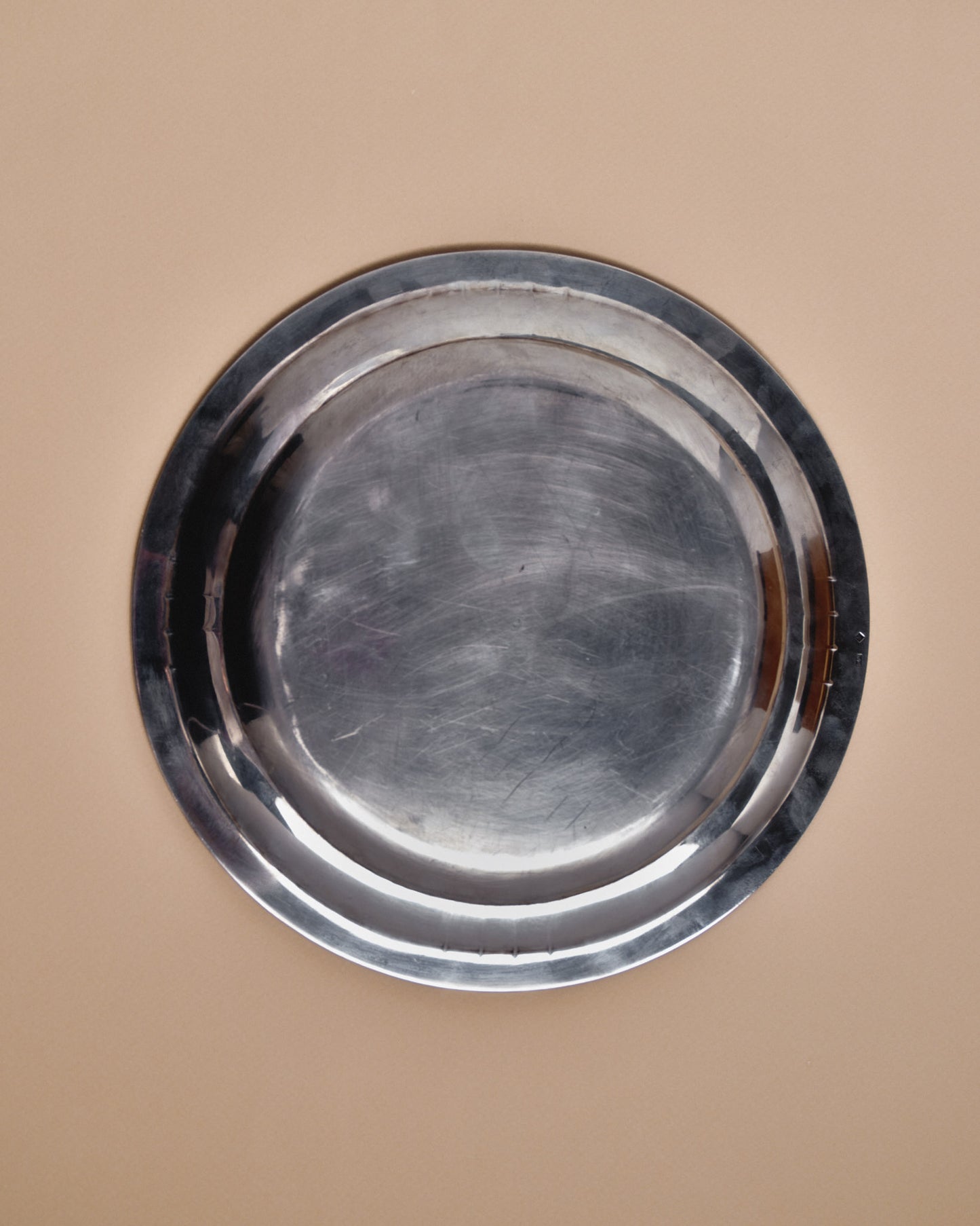 ROUND SILVER-PLATED METAL PLATE, SAMUEL ASKENFELD