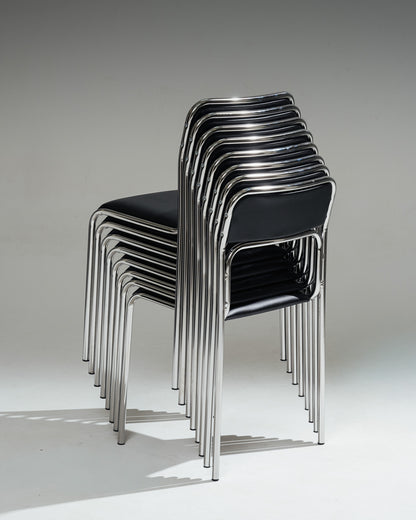 SET OF 4 BLACK FAUX LEATHER AND TUBULAR STEEL CHAIRS, 1980s
