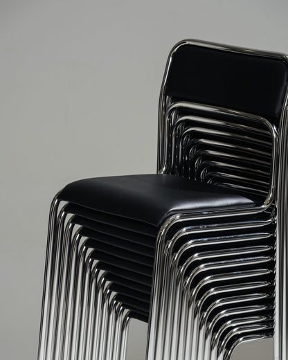 SET OF 4 BLACK FAUX LEATHER AND TUBULAR STEEL CHAIRS, 1980s