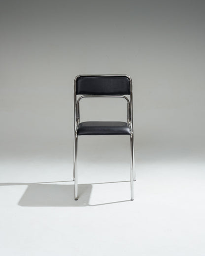 CHAISE EN ACIER TUBULAIRE ET SIMILI CUIR NOIR, 1980s