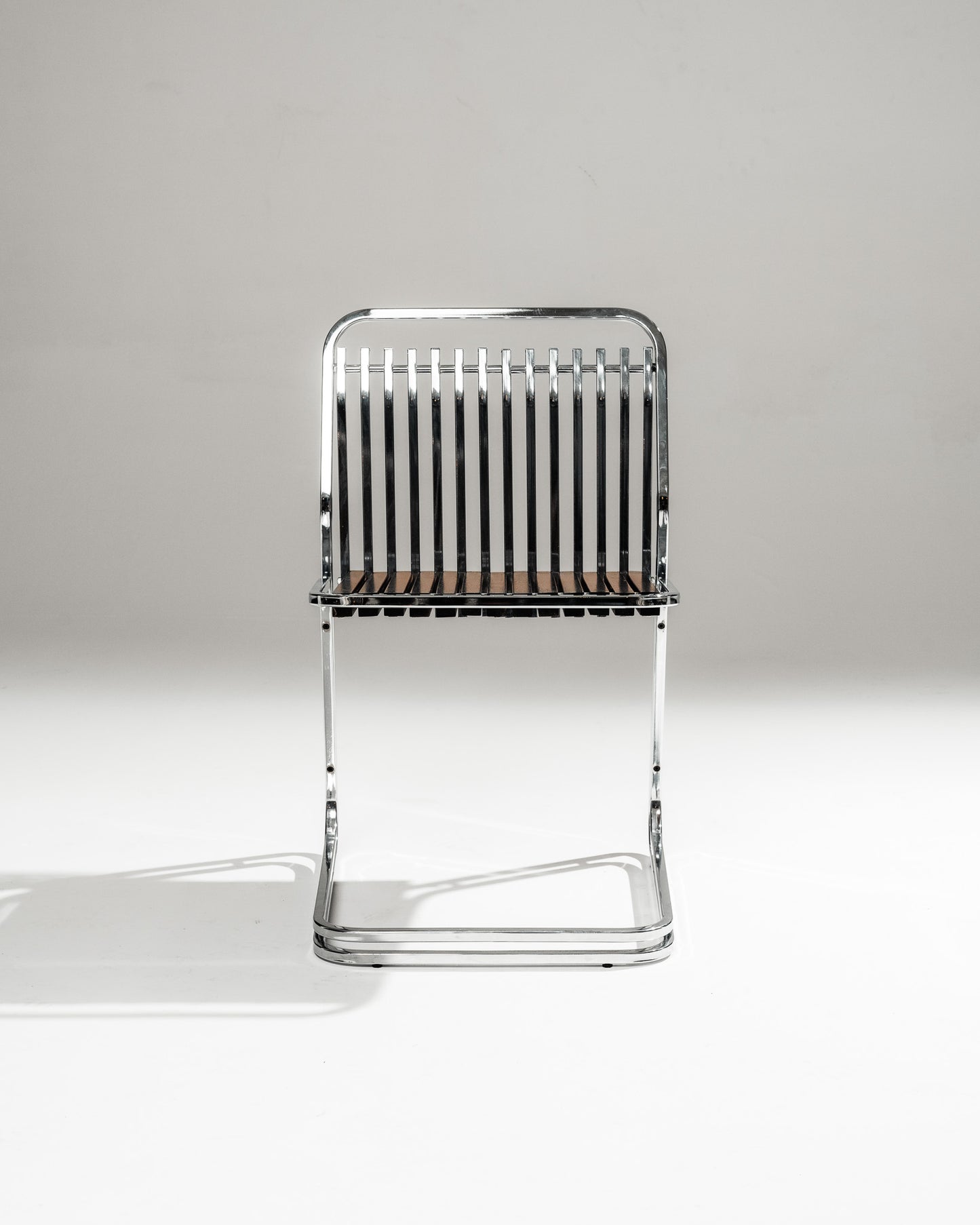 CANTILEVER CHAIR IN CHROME-PLATED STEEL AND WOOD, 1970s
