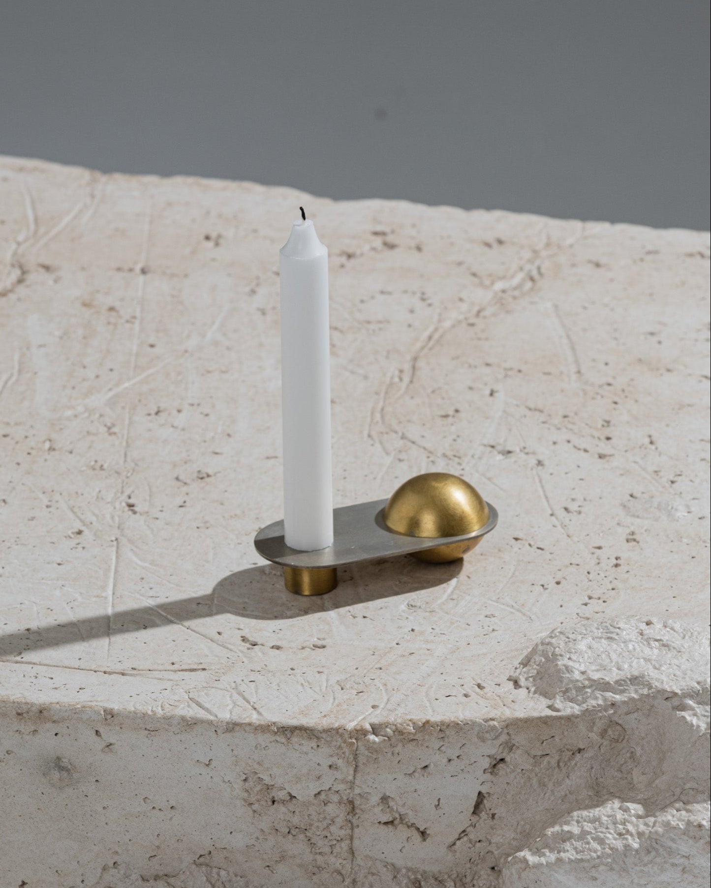 CANDLE HOLDER FROM THE "ÉPURE" COLLECTION IN BRASS