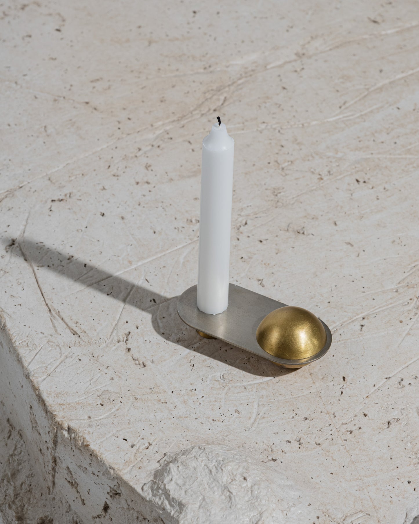 CANDLE HOLDER FROM THE "ÉPURE" COLLECTION IN BRASS