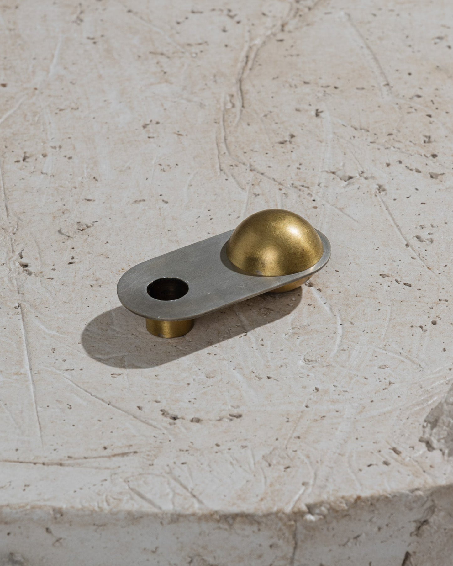 CANDLE HOLDER FROM THE "ÉPURE" COLLECTION IN BRASS