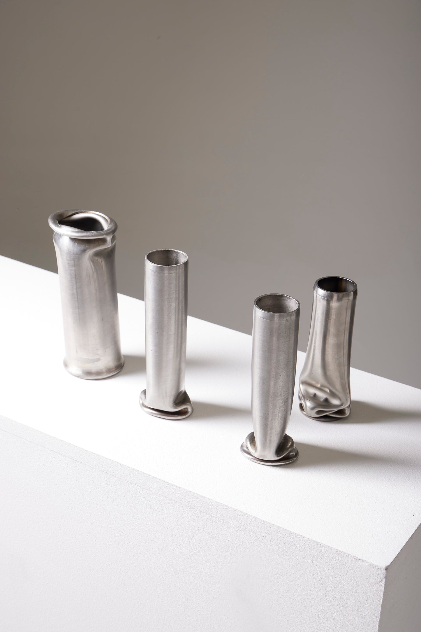 COMPRESSION STAINLESS STEEL VASE