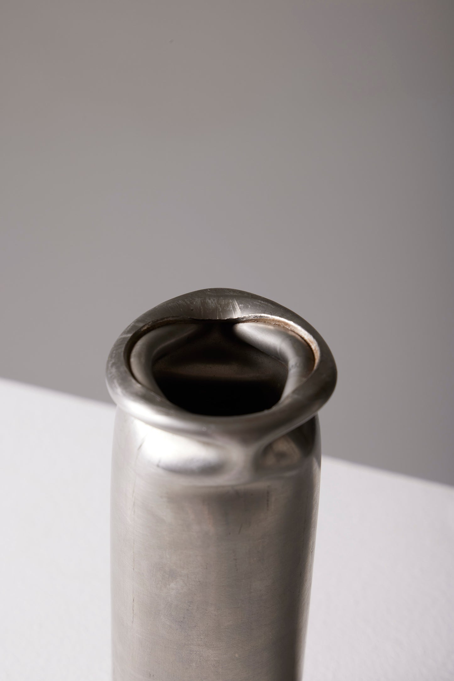 COMPRESSION STAINLESS STEEL VASE