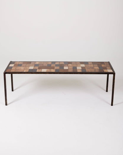 Table basse en céramique du designer Mado Jolain, années 1960. La structure en fer forgé a été réalisée par René Legrand. Le plateau en céramique est dans les tons marron et beige. Très bel état