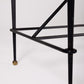  Bureau d'exception du designer Jacques Adnet (1900-1984), années 1940. Le piétement est en fer forgé patiné noir, le plateau en verre et les détails du bureau sont en cuir et laiton. Les deux tiroirs coulissants sont recouverts de cuir piqué à la main. Jacques Adnet a laissé une empreinte indélébile dans le monde du design avec son style distinctif et son innovation constante, il collabora notamment avec la maison Hermès sur des meubles en cuir de haute qualité, sa marque de fabrique.