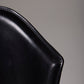 Chaise en cuir noir Protis