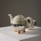 Ceramic and metal teapot