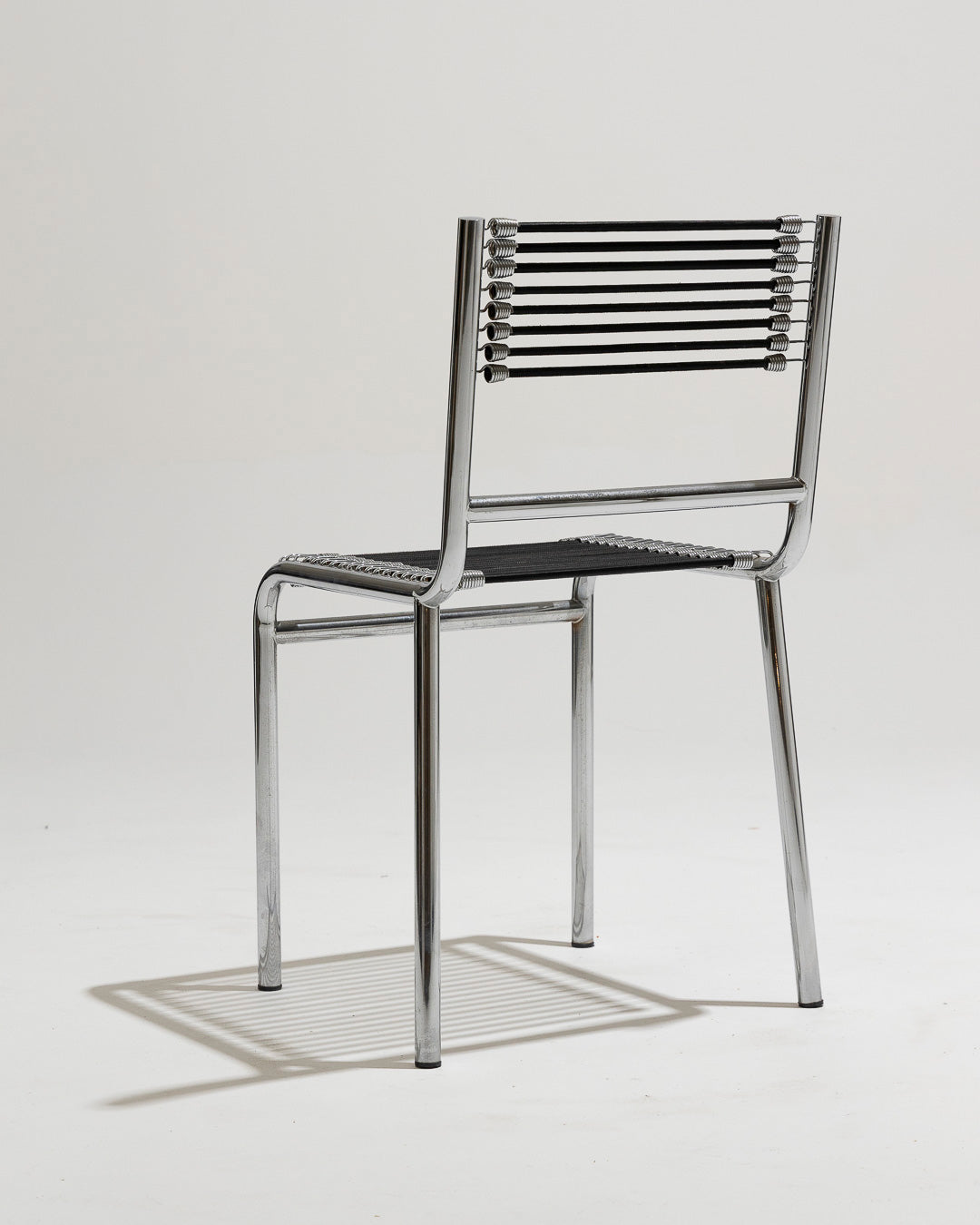 PAIR OF STEEL AND ELASTIC CORD CHAIRS, RENÉ HERBST, 1970s