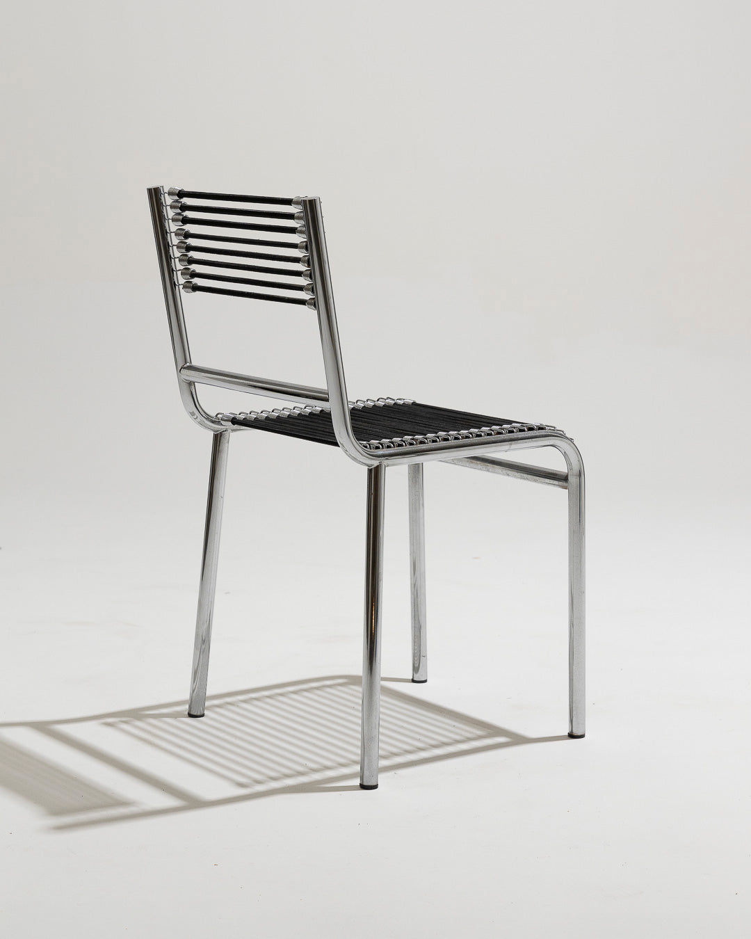 PAIR OF STEEL AND ELASTIC CORD CHAIRS, RENÉ HERBST, 1970s