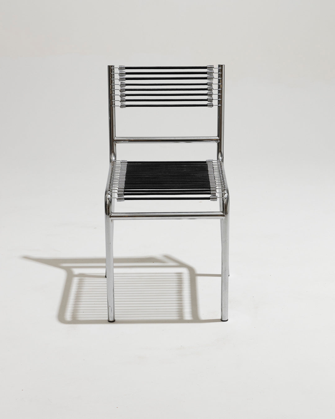 PAIR OF STEEL AND ELASTIC CORD CHAIRS, RENÉ HERBST, 1970s