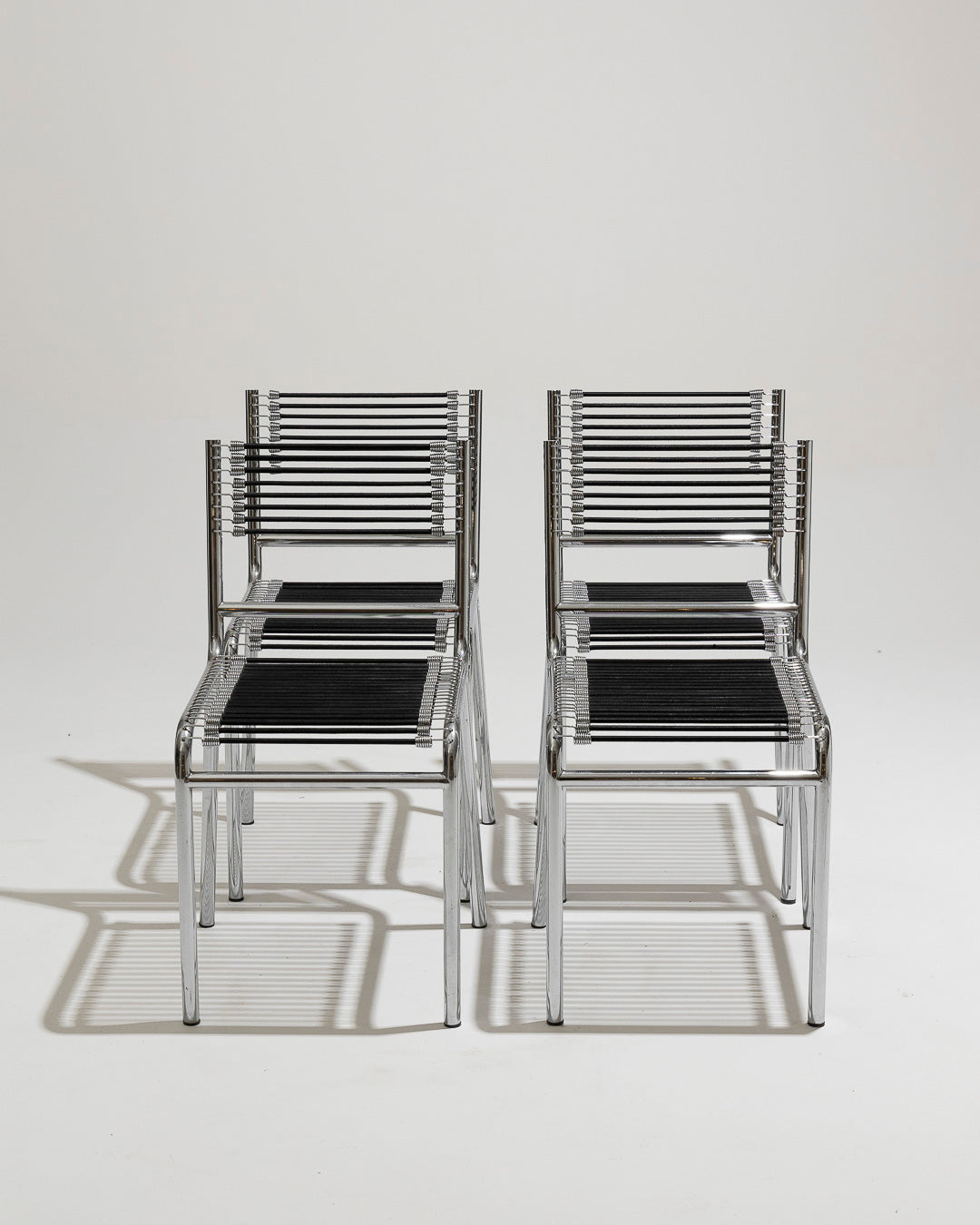 SET OF 4 STEEL AND ELASTIC ROPE CHAIRS, RENÉ HERBST, 1970s 