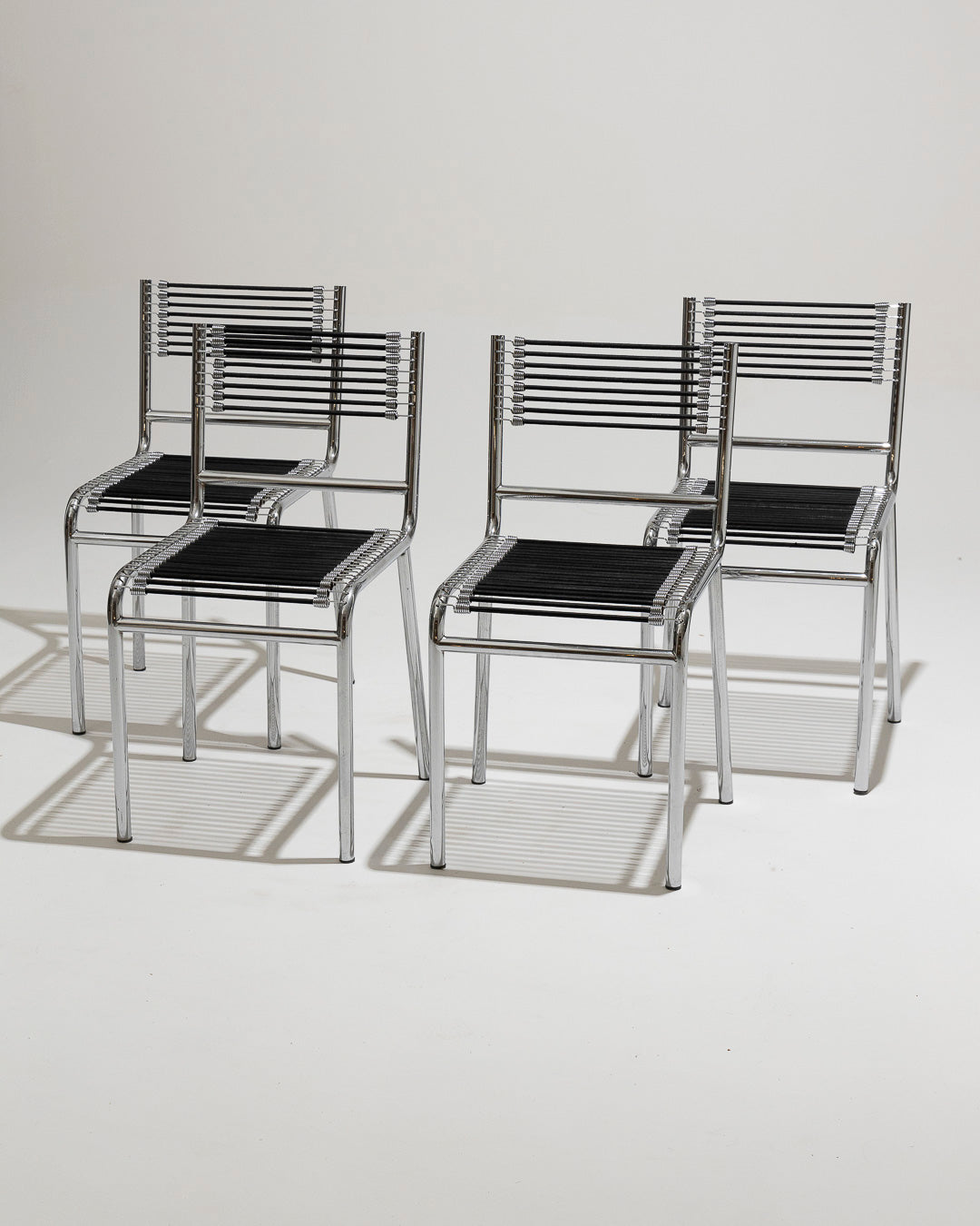 SET OF 4 STEEL AND ELASTIC ROPE CHAIRS, RENÉ HERBST, 1970s 