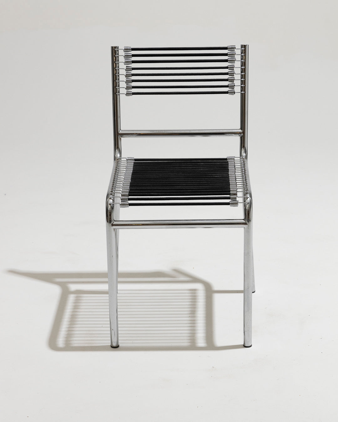 PAIR OF STEEL AND ELASTIC CORD CHAIRS, RENÉ HERBST, 1970s