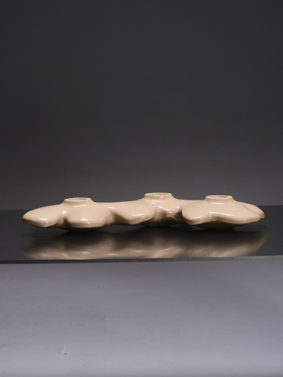 Triple sandstone candlestick