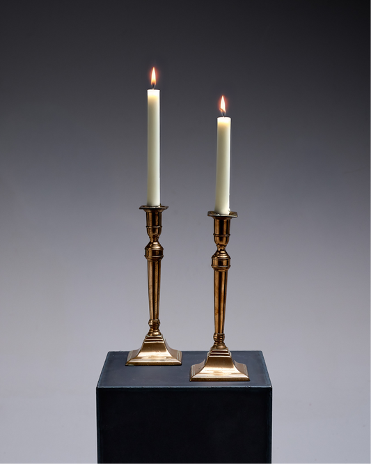 Pair of gold-plated metal column candlesticks, 1970s