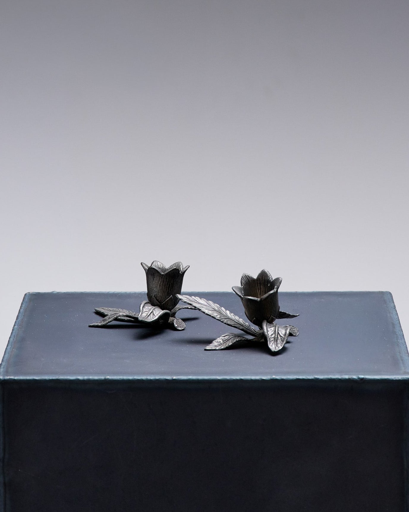 PAIR OF PEWTER FLOWER CANDLESTICKS, 1970S